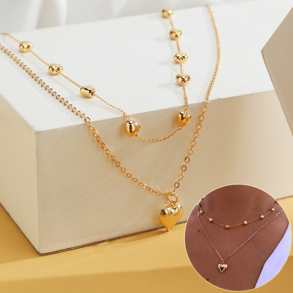 Captivating Layers: The Double-Heart Pendant Necklace